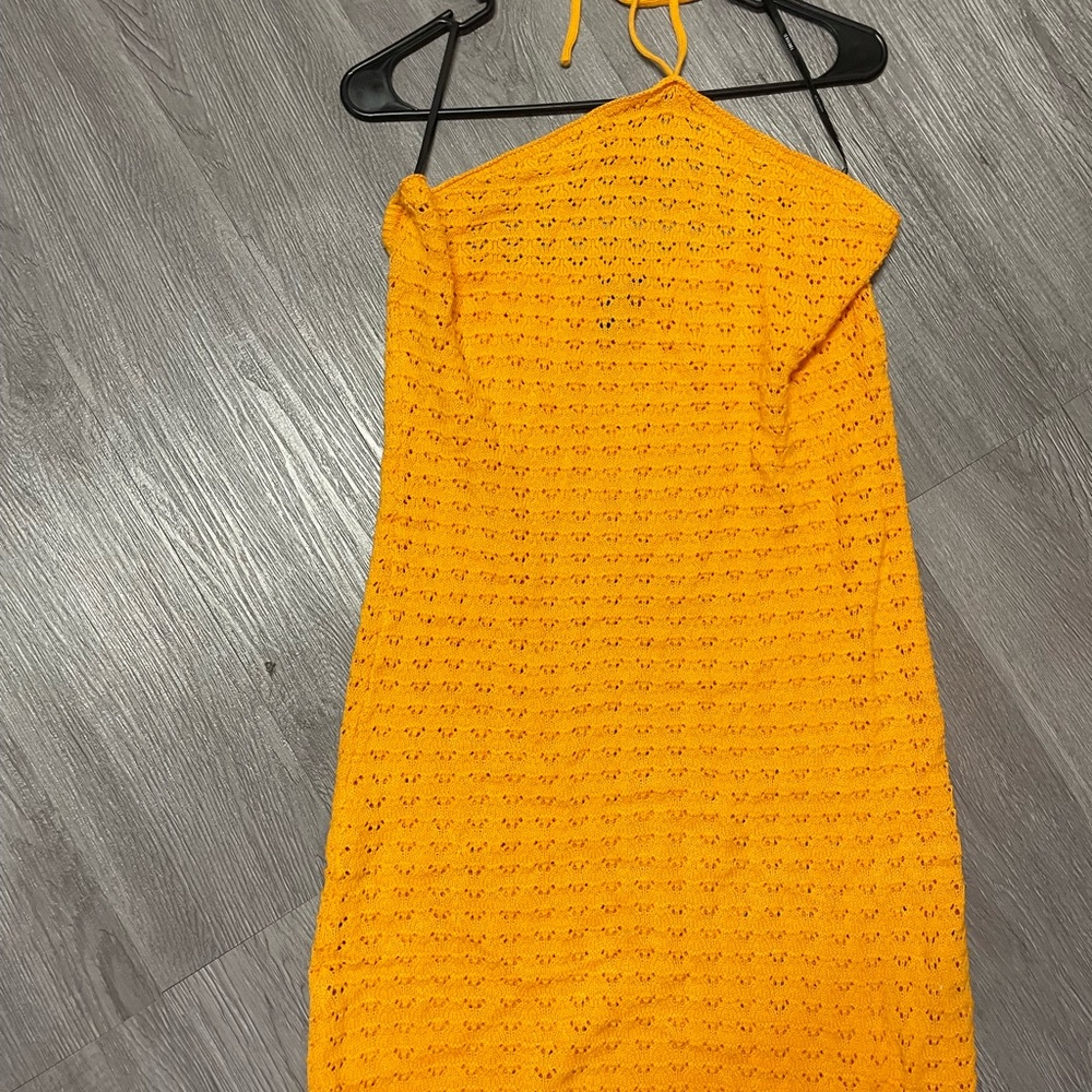 Orange Crochet halter dress.
New